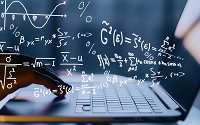 Math equations floating above a laptop keyboard.