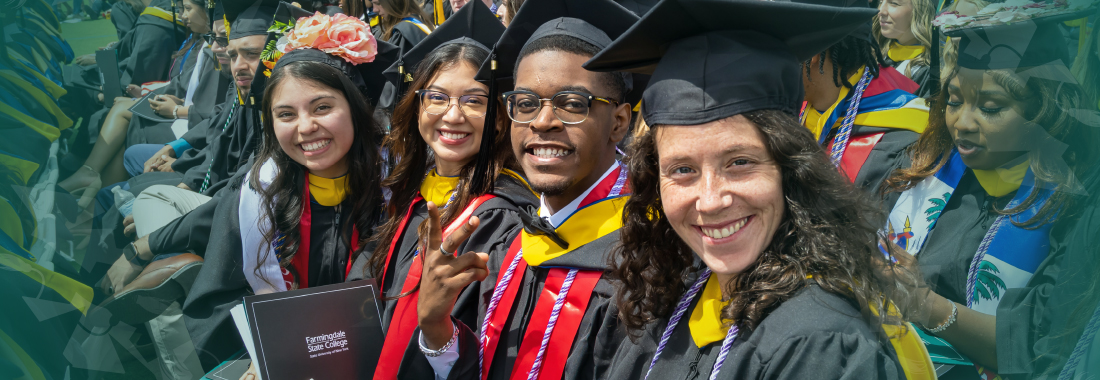 students at graduation with cap and gowns