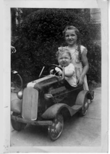 Douglas and Claire Berg in a toy car