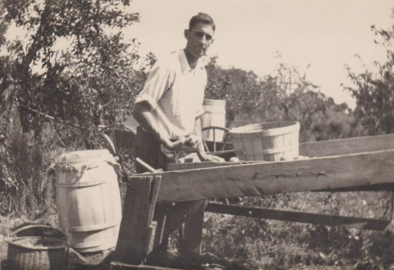 Southard on his farm in Red Hook with apples